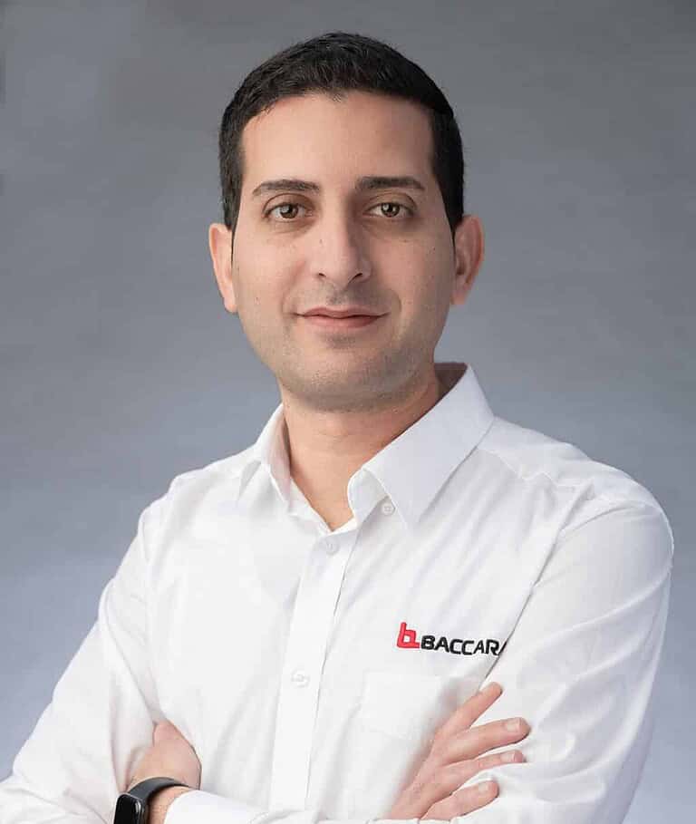 Industrial automation expert in white shirt with Baccara logo, process control specialist.