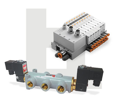 Industrial automation fluid control system with solenoid valves and control modules.